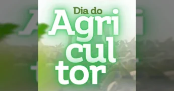 Agricultores de Nova Monte Verde em campo cultivando alimentos, celebração do Dia do Agricultor.