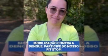 Mulher com óculos e camiseta verde claro, com distintivo da prefeitura, sorrindo e gesticulando em um ambiente arborizado, representando a mobilização da prefeitura de Guarantã do Norte contra a dengue. Créditos: Prefeitura Municipal de Guarantã do Norte / Instagram.