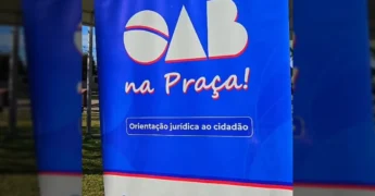 Bandeira da OAB Mato Grosso com o logo do projeto 'OAB na Praça' na cidade de Campos de Júlio. Créditos: Prefeitura Municipal de Campos de Júlio - MT / Instagram.