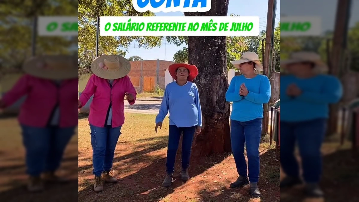 Imagem de três servidores da Prefeitura de Guiratinga em celebração pelo salário de julho, com chapéus de palha e sorrisos. Crédito: @prefeituraguiratinga.