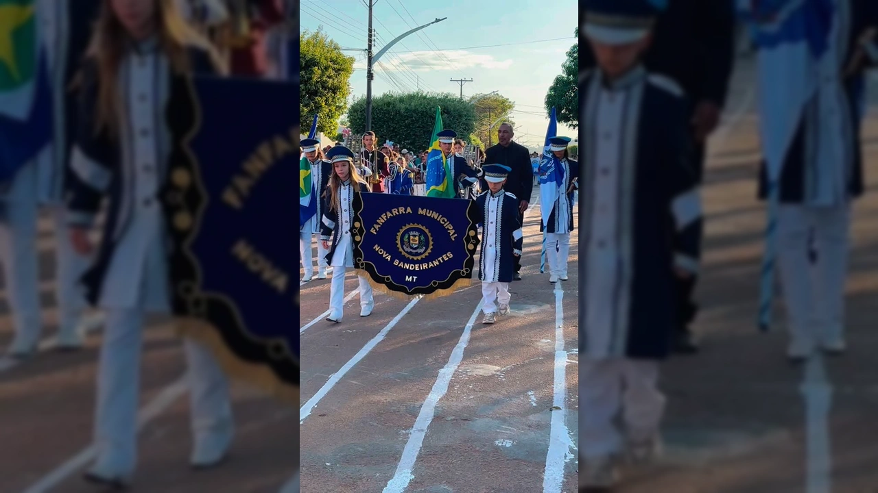 Jovens da Fanfarra Municipal de Nova Bandeirantes em desfile cívico, com bandeiras e instrumentos. Créditos: Prefeitura de Nova Bandeirantes / Instagram.