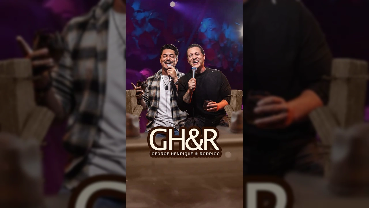 George Henrique & Rodrigo se apresentando em palco, com microfones e sorrisos, cenário da ExpoFresa. Créditos: expofresaoficial / Instagram
