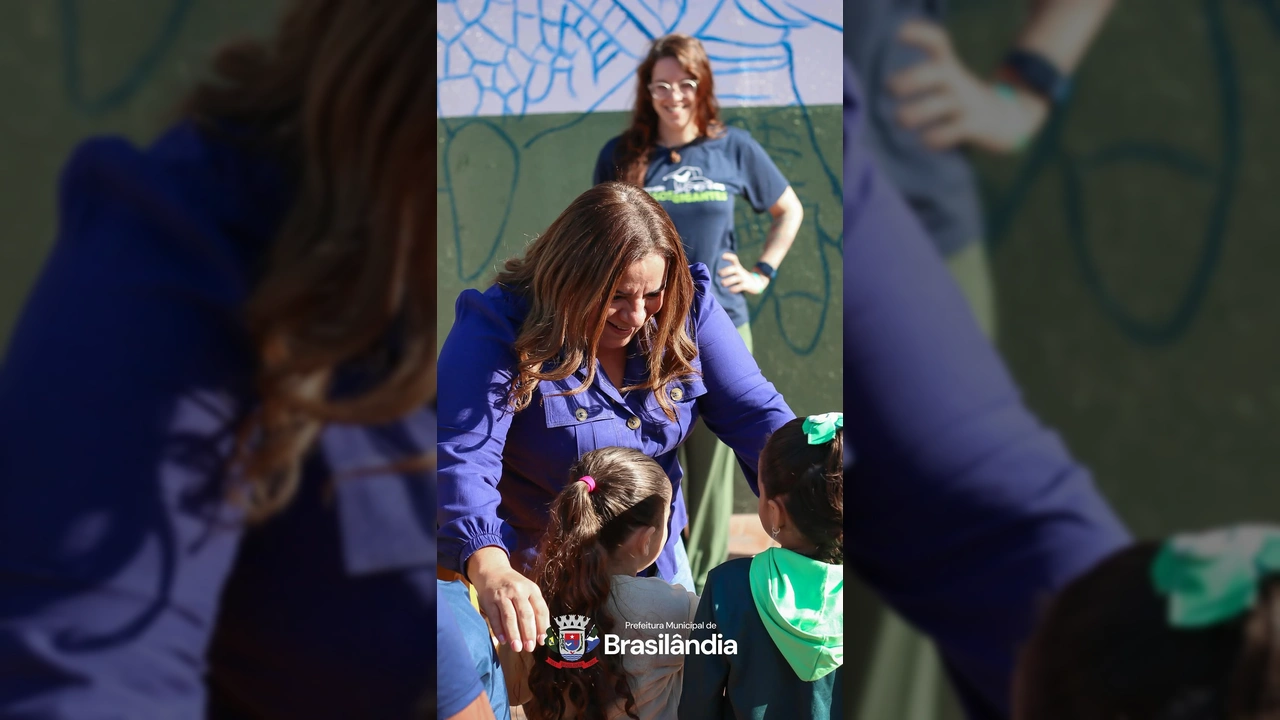 Imagem da Prefeita Márcia Amaral, representantes do ICAS, artistas e crianças em frente ao mural do tatu-canastra em Brasilândia. Crédito: Prefeitura Municipal de Brasilândia / Instagram.