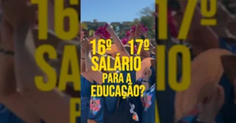 Professores e coordenadores da rede estadual de Mato Grosso celebrando, com foco na camiseta da Seduc e na bandeira do estado. Créditos: @govmatogrosso no Instagram.